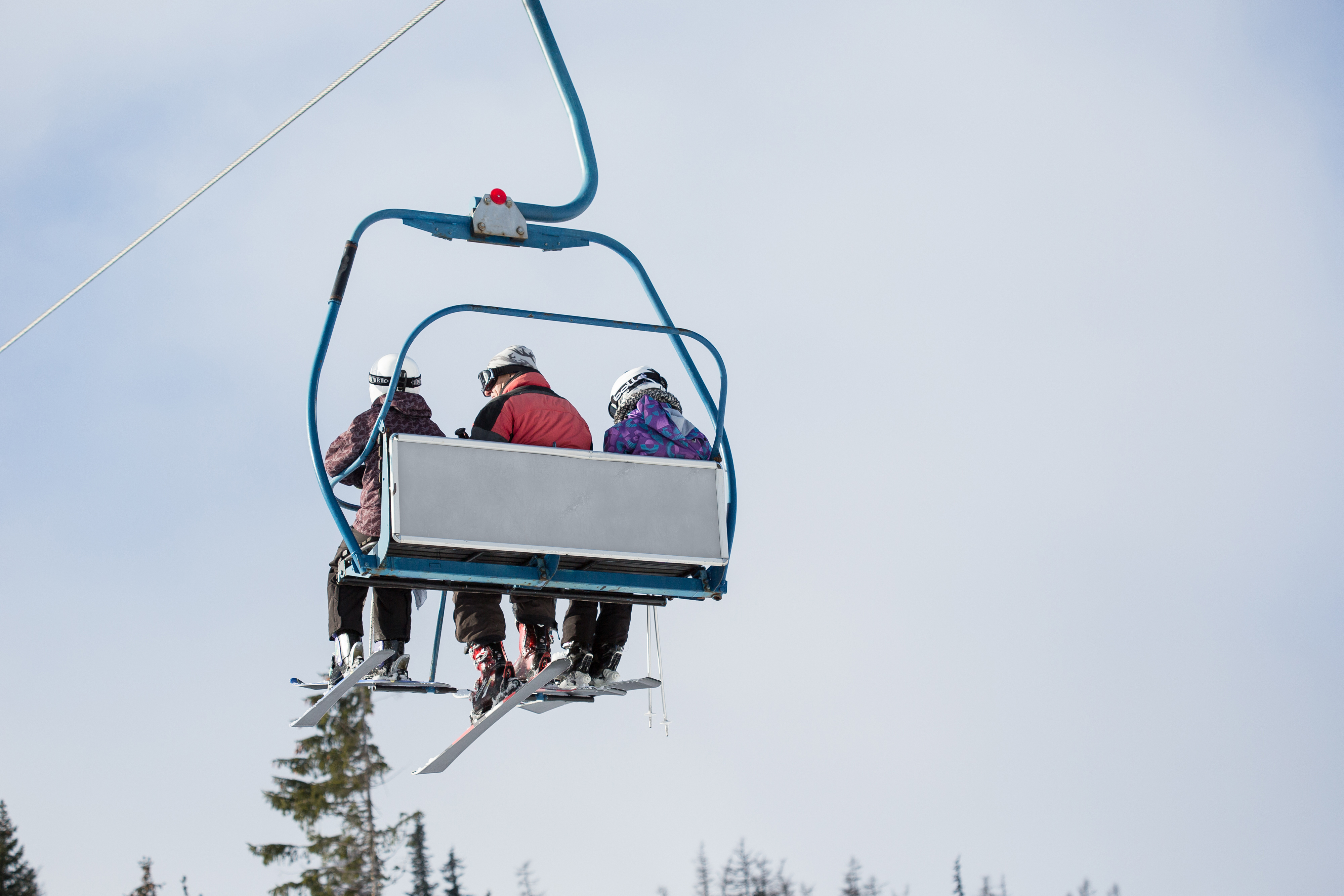 three-skiers-on-ski-lift-picjumbo-com